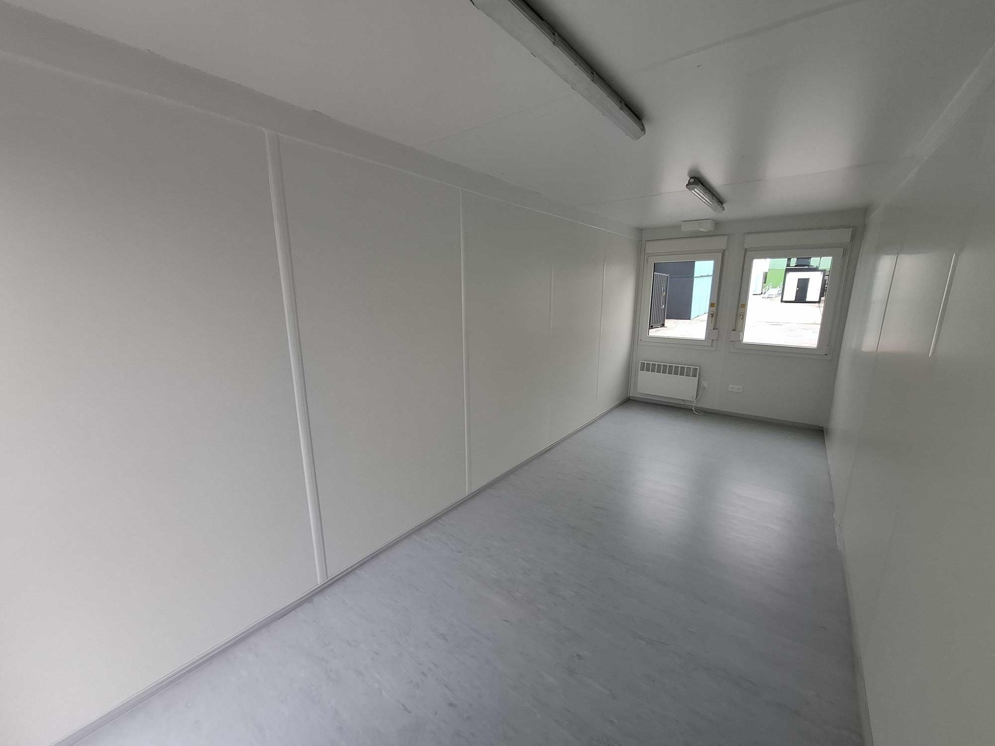 Interior of new 20FT office container Classic Line with short side windows from Mechanic International