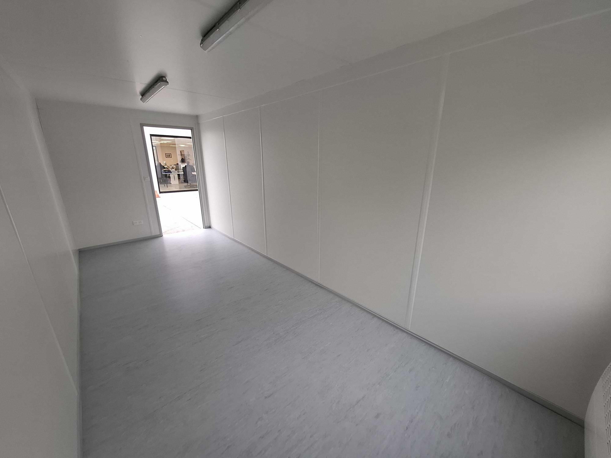 Interior of new 20FT office container Classic Line with short side windows from Mechanic International