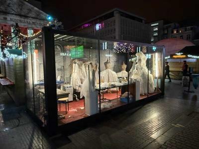 Glass container unit by Major set up as a costume atelier for De Munt at the Brussels Christmas market.